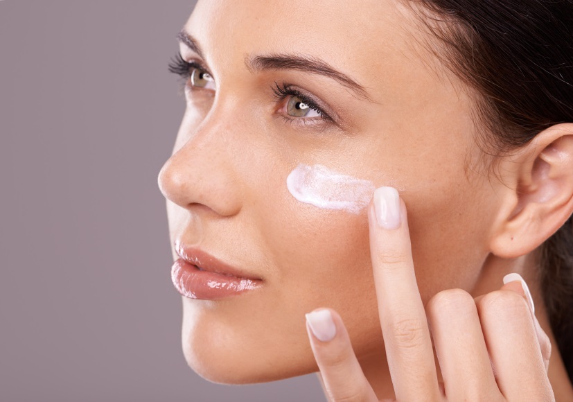 A young woman in the middle of her skincare routine